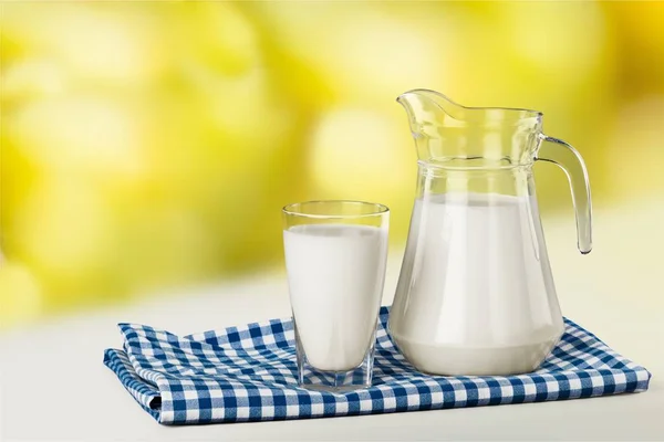 Glass of milk and jug — Stock Photo, Image