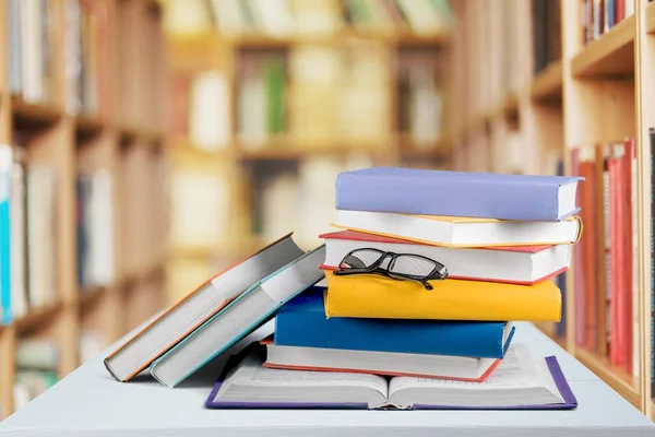 Heap of books with glasses — Stock Photo, Image
