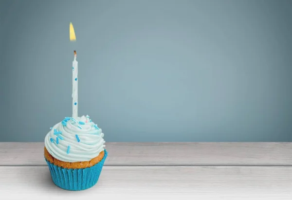 Festive cupcake with candle — Stock Photo, Image