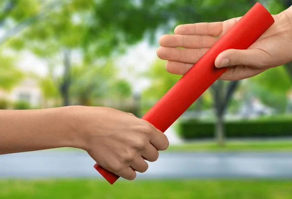 Baton relé sendo passado — Fotografia de Stock