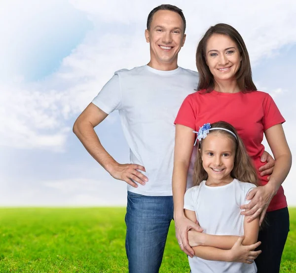 Feliz familia sonriente con hija —  Fotos de Stock