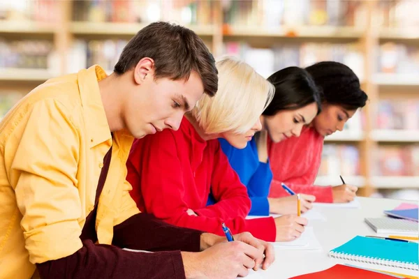 Students writing notes — Stock Photo, Image