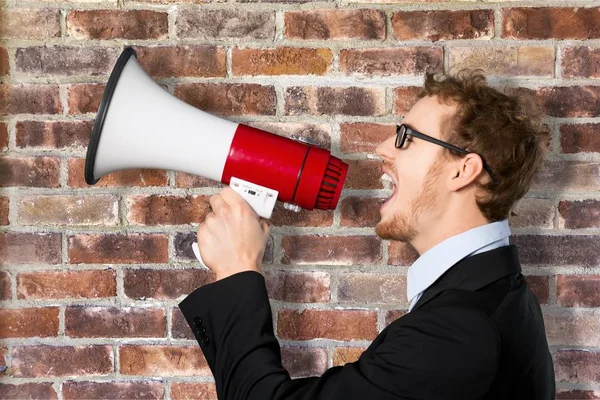 Business man with megaphone — Stock Photo, Image