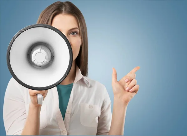 Beautiful woman shouting into megaphone — Stock Photo, Image