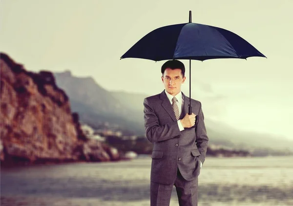 Business man with umbrella — Stock Photo, Image