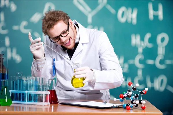 Scientist man with colored liquid Stock Image