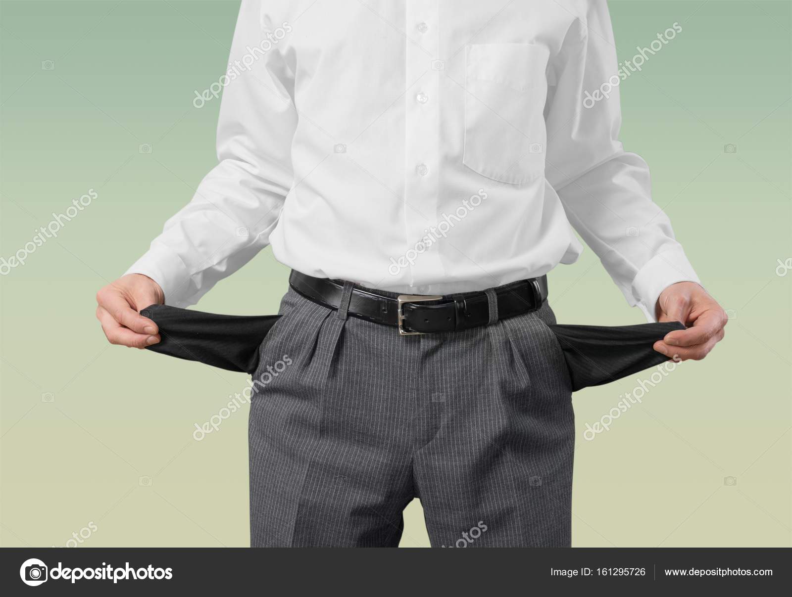 Businessman with empty pockets Stock Photo by ©billiondigital 161295726