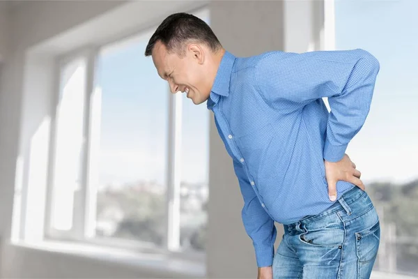 Man feeling pain in back — Stock Photo, Image