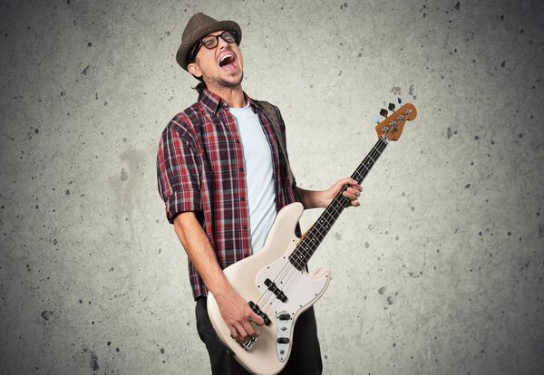 handsome young man play guitar