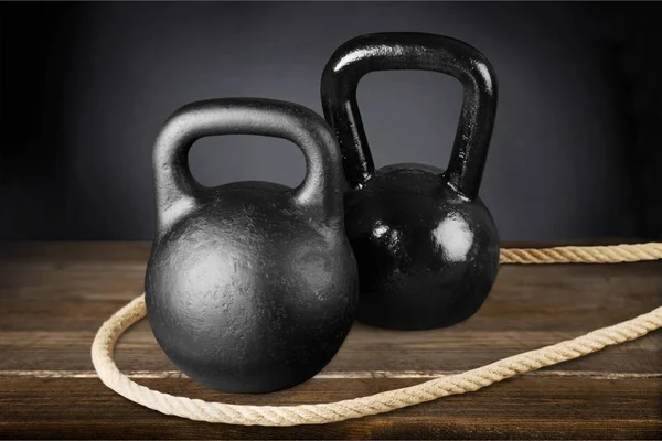 Kettle bells and rope — Stock Photo, Image