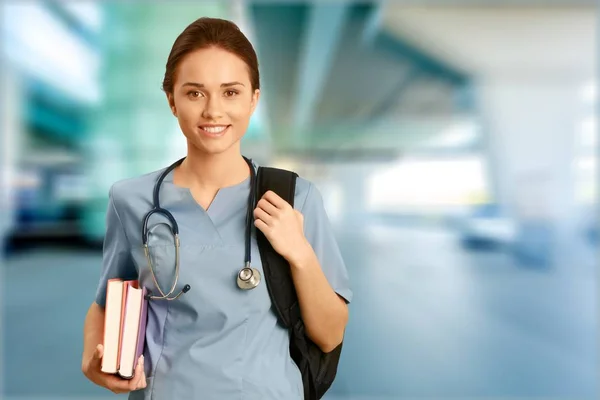 Doctor with books on clinic — Stock Photo, Image