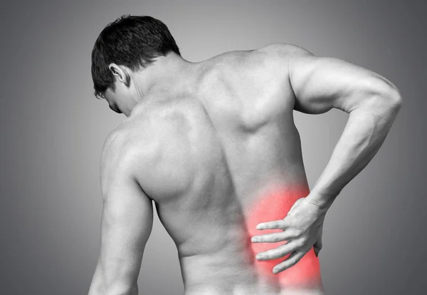 Man suffering from pain in back — Stock Photo, Image