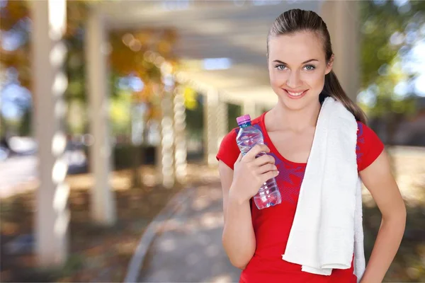 Young woman holding water — Stock Photo, Image