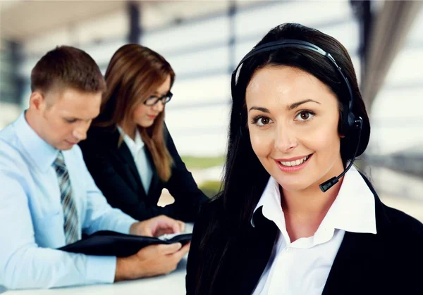 Beautiful businesswoman in headset — Stock Photo, Image