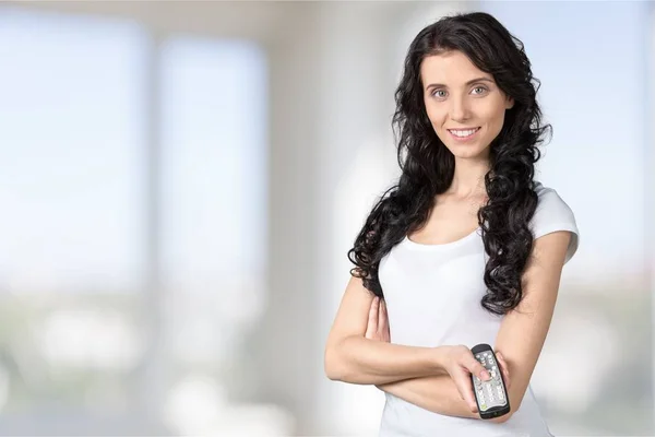 Woman holding remote controller — Stock Photo, Image