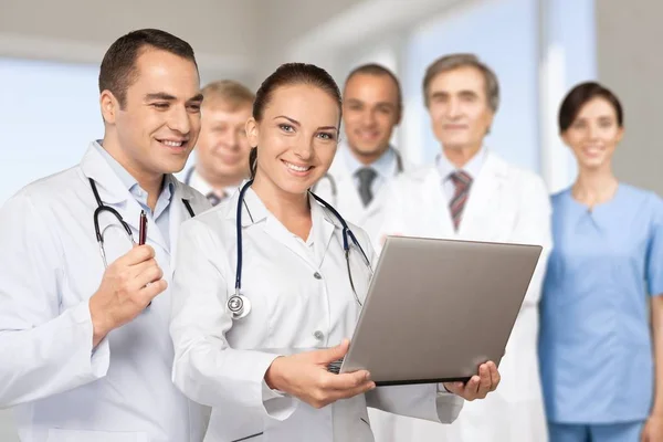 Doctors using laptop on conference — Stock Photo, Image