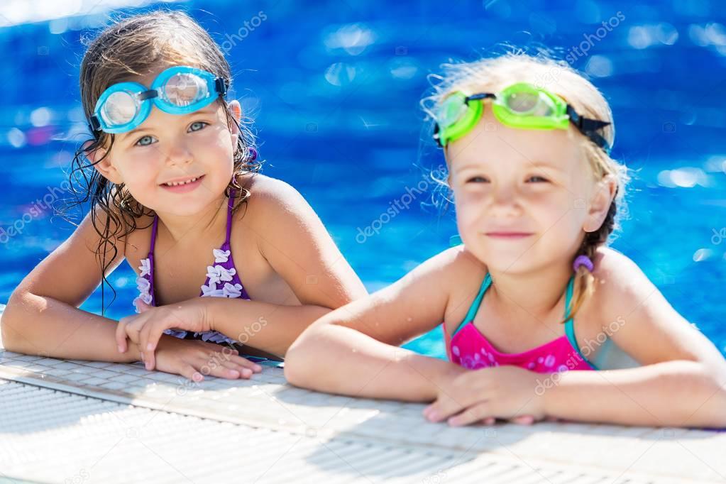 girls having fun in the pool