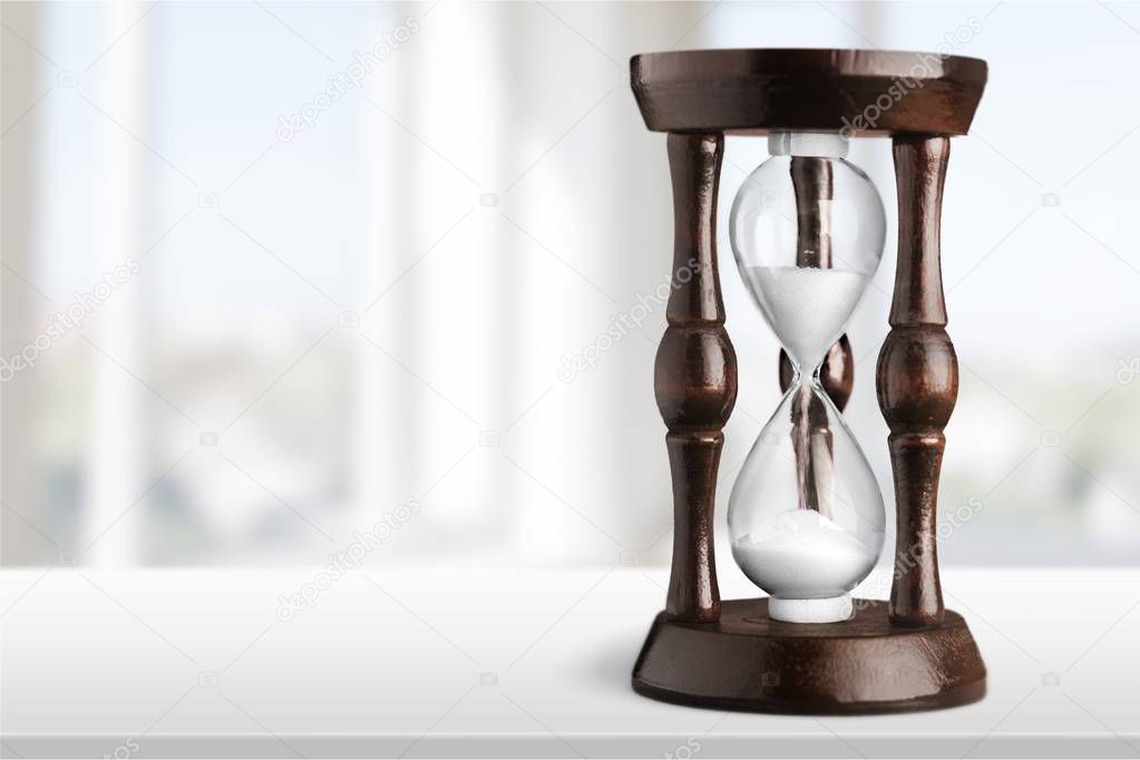 Sand running in hourglass