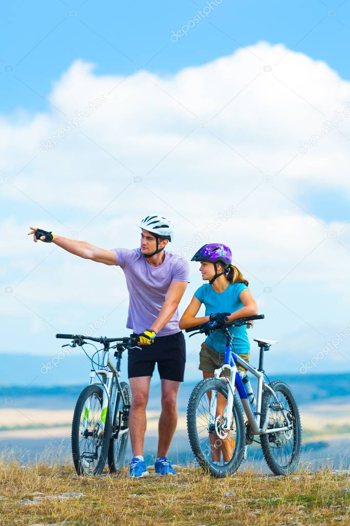  couple riding bicycle s