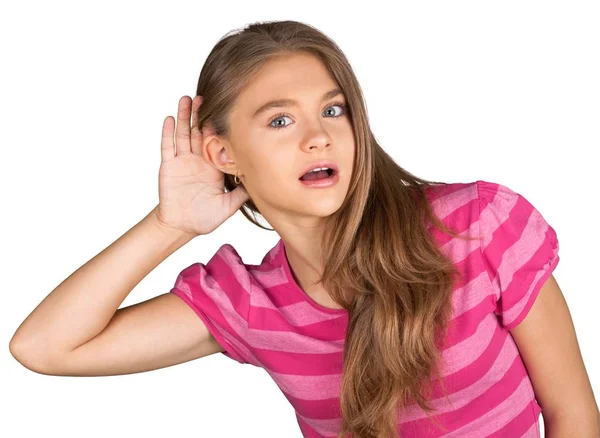 Menina ouvindo com a mão na orelha — Fotografia de Stock