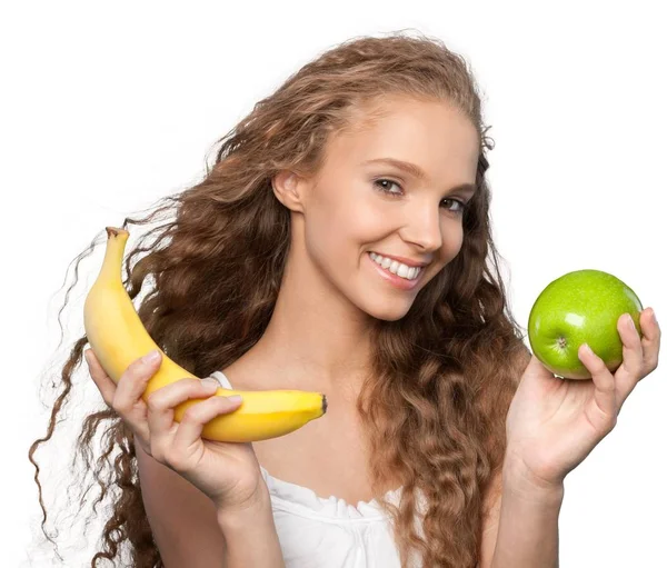 Młoda kobieta z jabłek i bananów — Zdjęcie stockowe