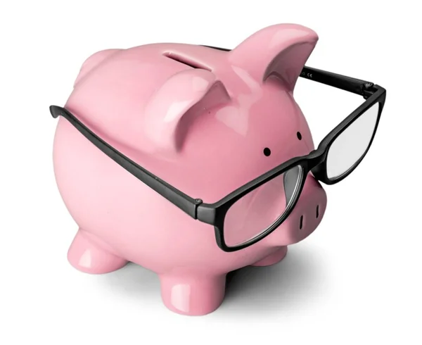 Piggy bank in glasses — Stock Photo, Image