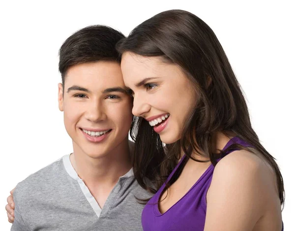 boldog, fiatal pár, átölelve a elszigetelt fehér háttér 