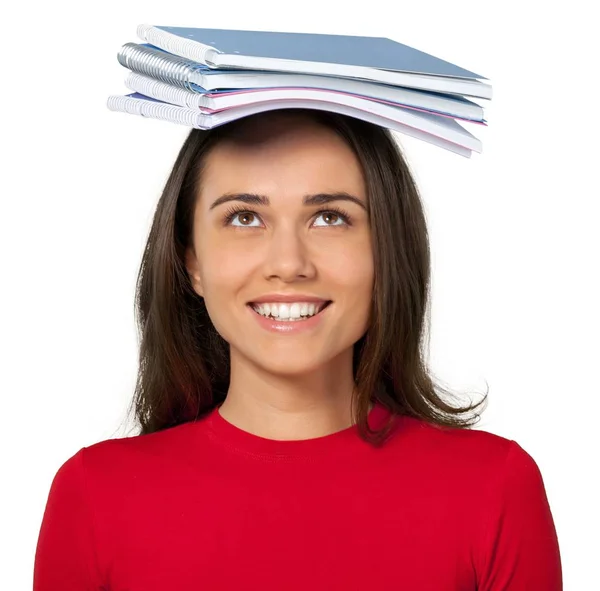女孩的笔记本在她的头上孤立的白色背景 — 图库照片