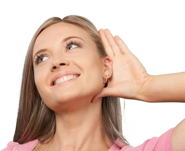 Девушка слушает с рукой на ухе — стоковое фото