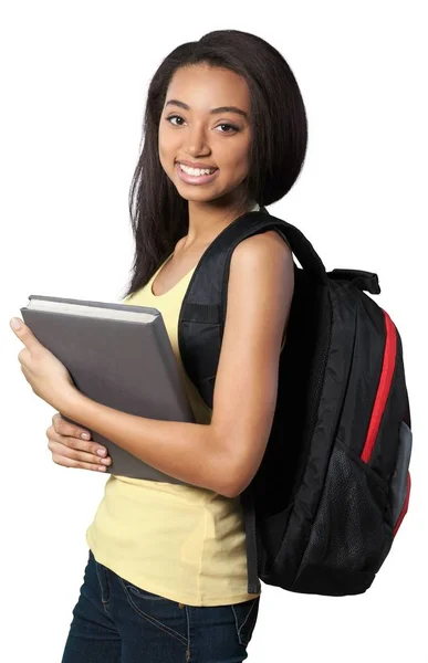 Mulher com mochila segurando livro — Fotografia de Stock