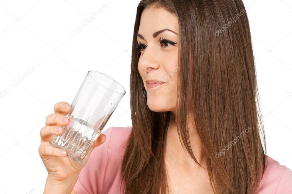 Young woman drinking water isolated on white background