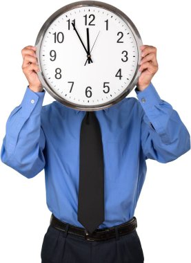 İş adamı saati elinde tutuyor.