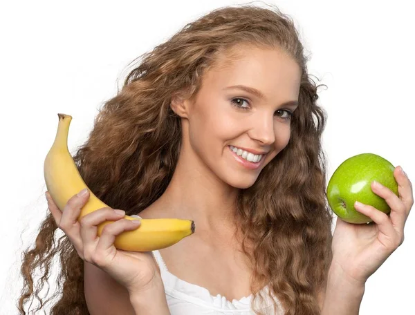 Νεαρή γυναίκα με το μήλο και μπανάνα — Φωτογραφία Αρχείου