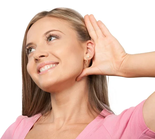 Girl listening with hand on ear — Stock Photo, Image