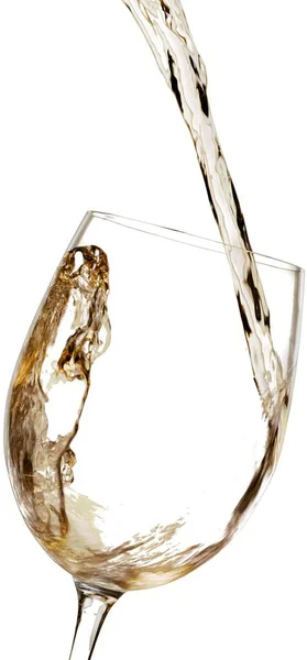 White wine pouring in glass — Stock Photo, Image