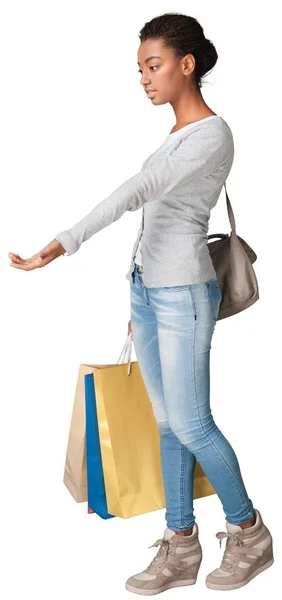 Молодая женщина с сумками — стоковое фото
