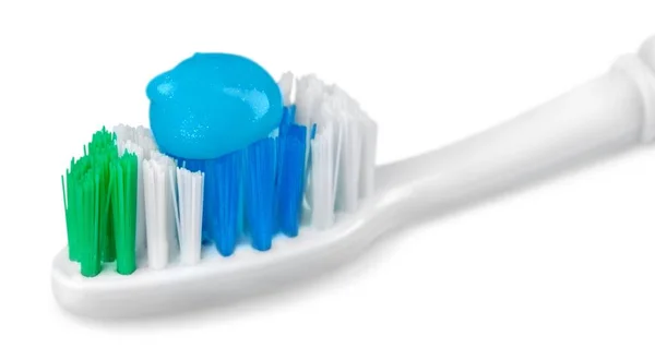 Brosse à dents avec dentifrice sur fond blanc — Photo