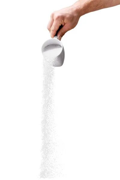 Наливать белый сахар — стоковое фото