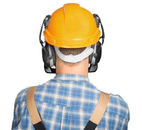 Homem em uniforme de trabalho e capacete — Fotografia de Stock