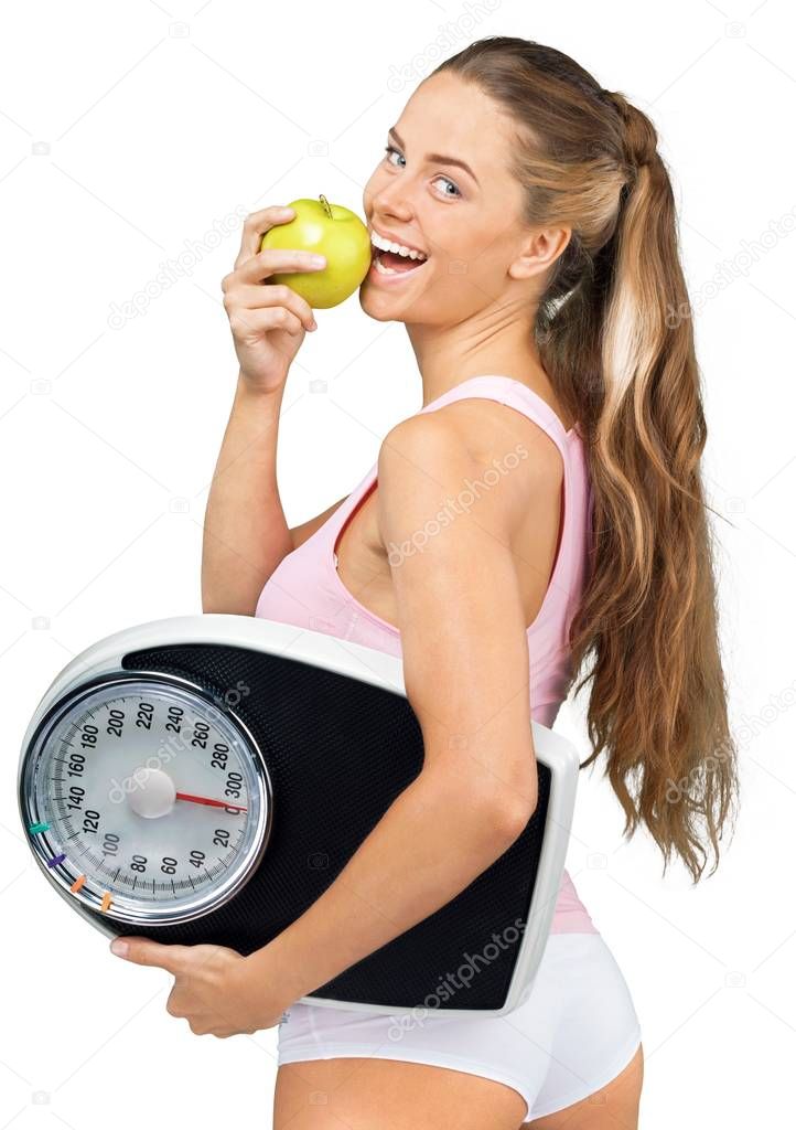 Cute woman with scales eating apple isolated on white background