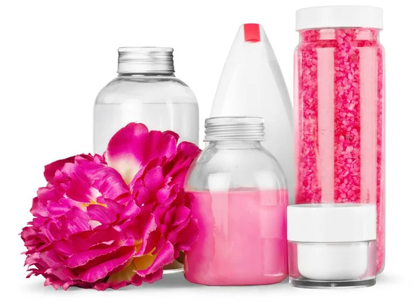 Recipientes cosméticos e flores — Fotografia de Stock