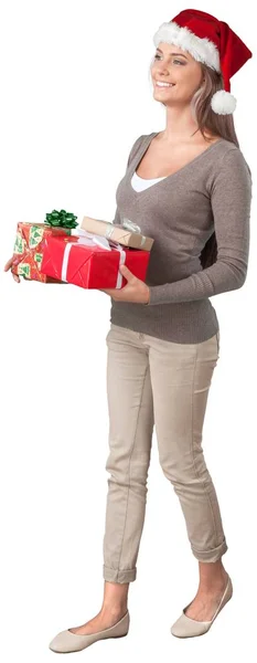 Жінка в Санта hat з подарунками — стокове фото