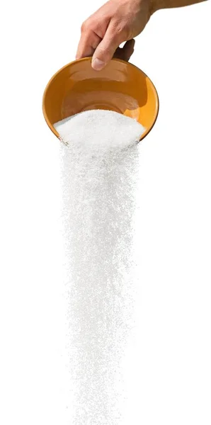 Kaatamalla valkoista sokeria — kuvapankkivalokuva
