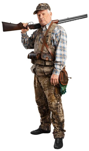 Male hunter standing with gun 