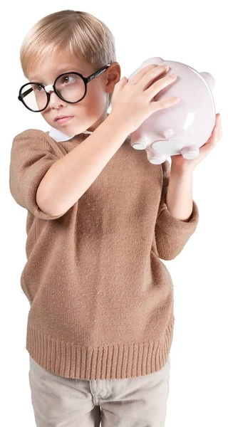 Jongen in glazen houden piggy bank — Stockfoto