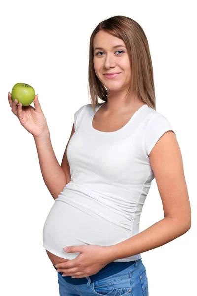 Pregnant woman holding apple — Stockfoto