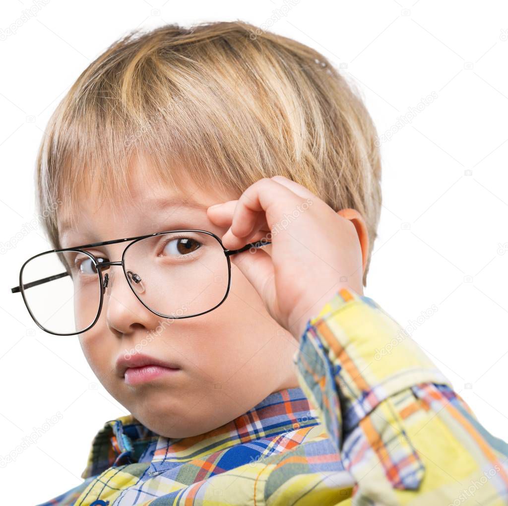 cute little boy in glasses isolated on white background