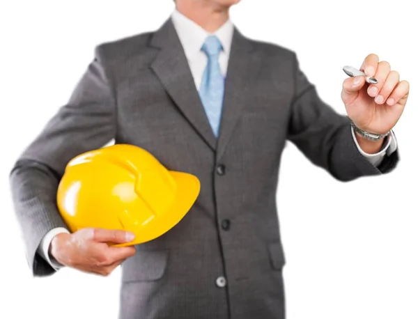 Empresário segurando na mão capacete amarelo — Fotografia de Stock