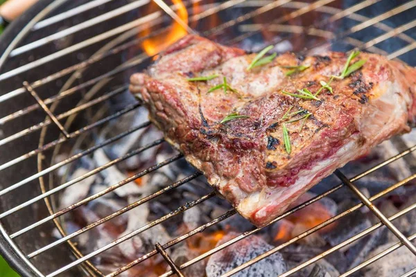 Meat grilling outdoors — Stock Photo, Image