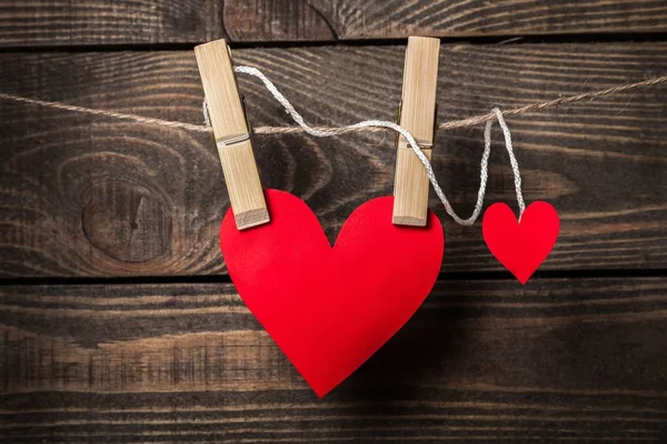 Red hearts hanging on a branch — Stock Photo, Image